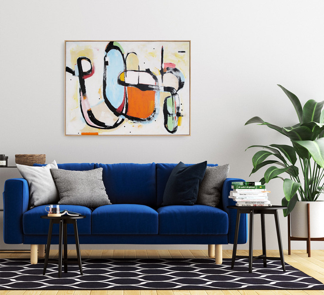 Vibrant, gestural abstract painting by abstract NZ artist Kirsty Black hanging above a blue couch