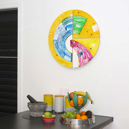 Petticoat Drama Queen, playful  circular abstract painting hanging in a kitchen