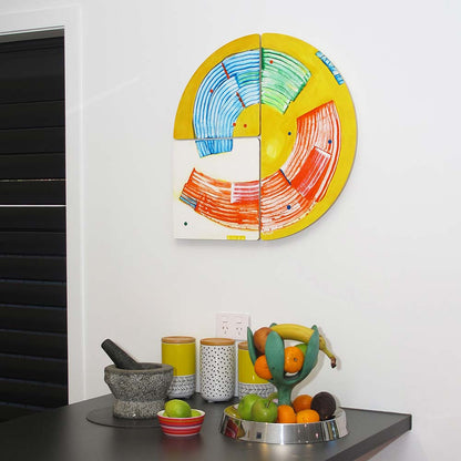 Modern, modular painting hanging in the kitchen