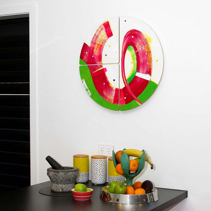 Round abstract painting, Sausage Dog Wheelie hanging in a modern kitchen